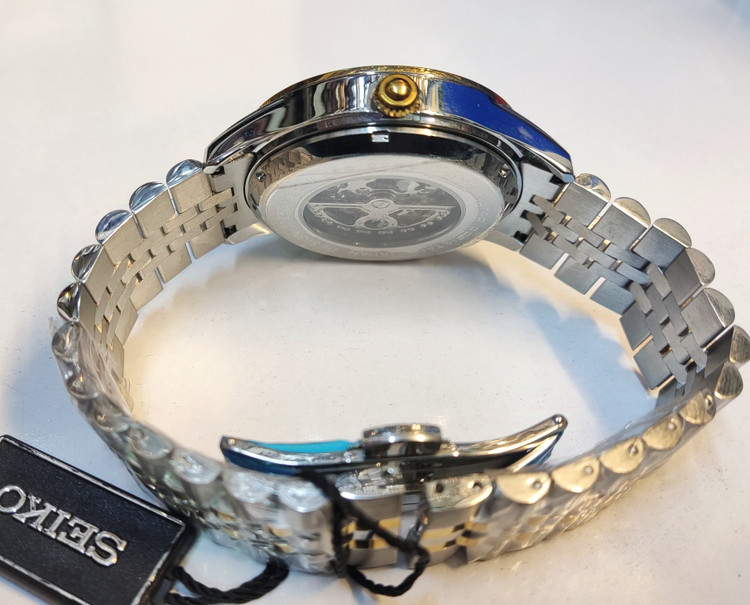 ساعت مچی مردانه SEIKO سیکو فلزی اتوماتیک مکانیکی اسکلتون درب پشت شیشه ای بند و قاب طلایی استیل صفحه استیل کد 3026